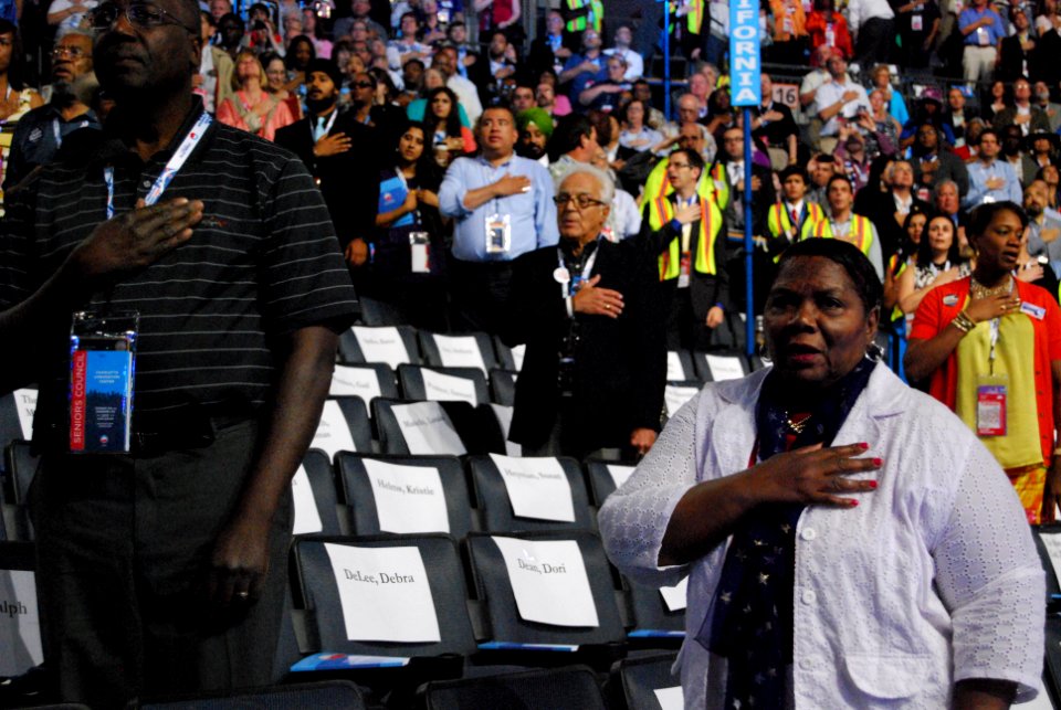 Delegates recite the Pledge of Allegiance at the opening of the Democratic National Convention