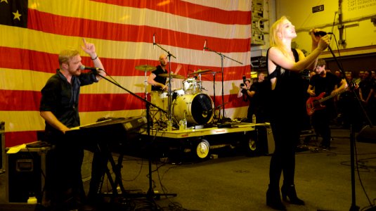 Delta Rae performs aboard USS Bataan 140725-N-JX484-123