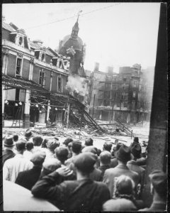 Demolishing a tower in London's Smithfield Market which was unsafe after it had been damaged by enemy action. New... - NARA - 541894 photo