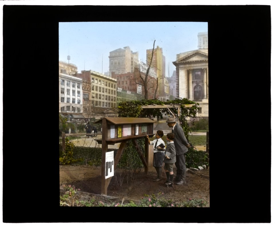 Demonstration garden, Bryant Park, 42nd Street and Fifth Avenue, New York, New York. Visitors studying gardening notices LCCN2007685077