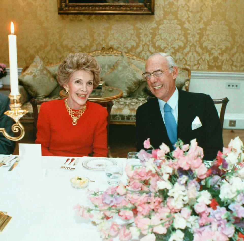 Denis Thatcher laughs with Nancy Reagan