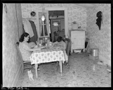 Dining room in home of Manuel Alcala, miner, living in company housing project. National Fuel Company, Monarch Mine... - NARA - 540467