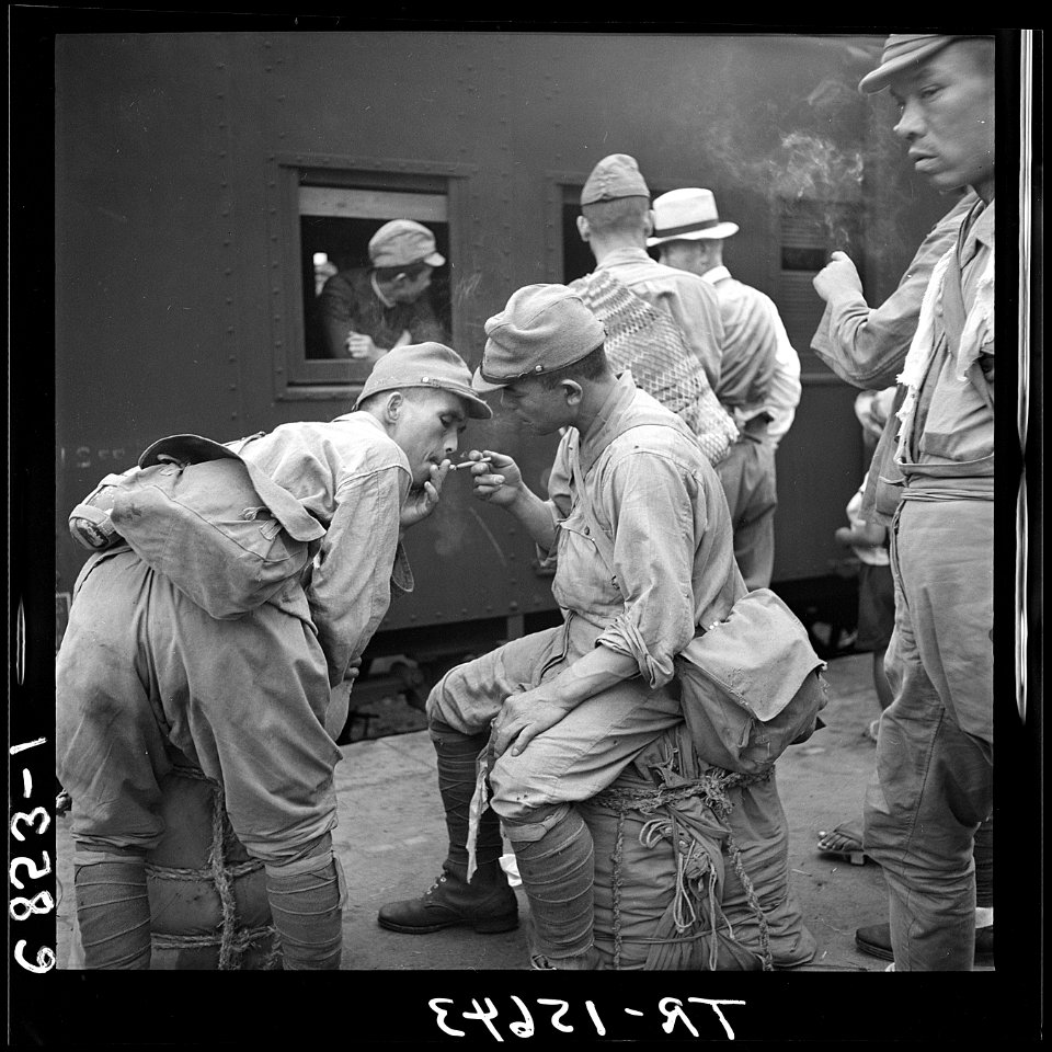 Discharged Japanese soldiers crowd trains as they take advantage of free transportation to their homes after end of... - NARA - 520936
