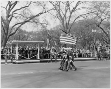 Distance view of President Truman in the reviewing stand during the Army Day parade. - NARA - 199769 photo