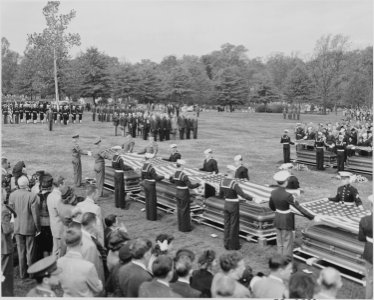 Distance view of President Truman attending the burial of twenty soldiers at Arlington National Cemetery. These... - NARA - 199683