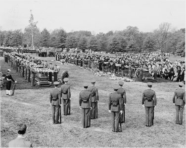 Distance view of President Truman attending the burial of twenty soldiers at the Arlington National Cemetery. These... - NARA - 199685 photo