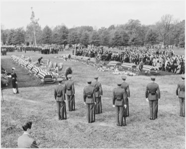 Distance view of President Truman attending the burial of twenty soldiers at Arlington National Cemetery. These... - NARA - 199686 photo