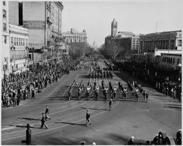Distance view of President Truman's inaugural parade showing a military band. - NARA - 200060