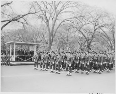 Distance view of President Truman in the reviewing stand watching the Army Day parade in Washington, D. C. - NARA - 199774