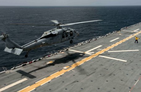 Distinguished visitors from Trinidad and Tobago visit USS America 140725-N-MD297-034