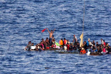 Distressed persons wait to be rescued by USS Rushmore. (18498397939)