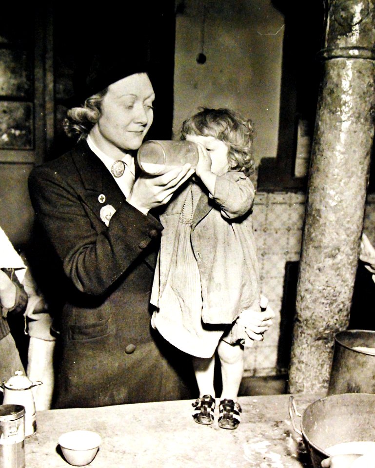 Distribution of milk to Arabian children in the Kasbah at Algiers, Algeria, 1943 (27602870445)