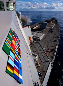 180205-N-RG482-106 - USS Ross (DDG-71) shoots its 5-inch gun during a live-fire exercise