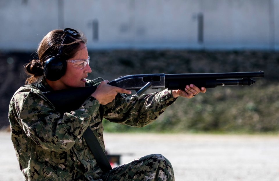 180308-N-LI768-2658 - PO2 Teresa Lopez-Webster fires Mossberg 500 shotgun in San Diego, California