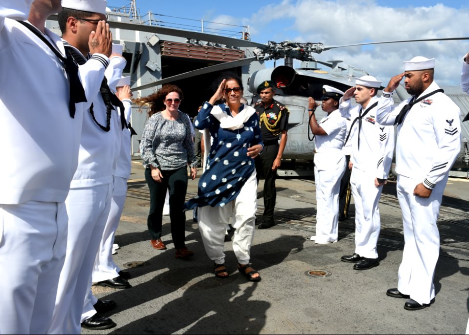 181206-N-QB805-136 - India's Minister of Defense Nirmala Sitharaman is piped ashore after touring the guided-missile destroyer USS Michael Murphy