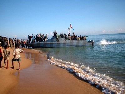 Loading LTTE cadres in calm sea photo