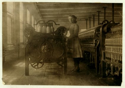 Annie Dugas, spinner at machine on top floor of Glenallen Mill. LOC nclc.02314