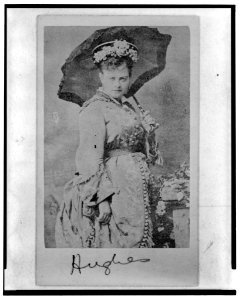 Annie Hughes, British actress, three-quarter length portrait, holding parasol, facing right LCCN2004682169