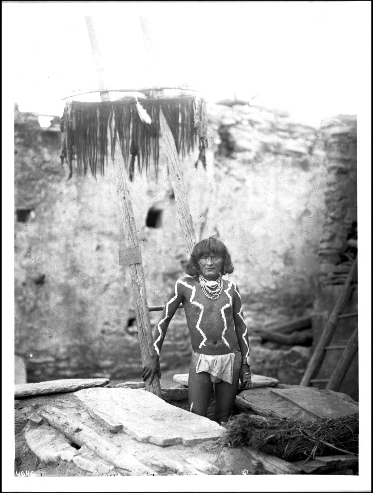 Antelope priest descending into kiva at pueblo of Walpi, Arizona, 1897 (CHS-4646)