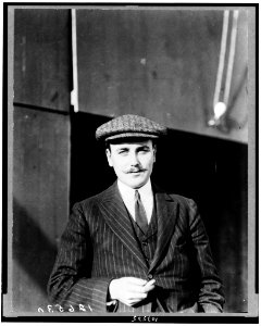 Anthony J. Drexel, Jr., millionaire aviator, half-length portrait, standing, facing forward, wearing cap LCCN91783781