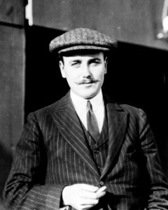 Anthony J. Drexel, Jr., millionaire aviator, half-length portrait, standing, facing forward, wearing cap LCCN91783781 (cropped)