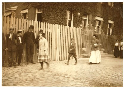Antone Simmons, small boy in center of picture, 61 Katharine St., Ward 6. In the twisting room. Birth certificate makes him 14. LOC nclc.02244