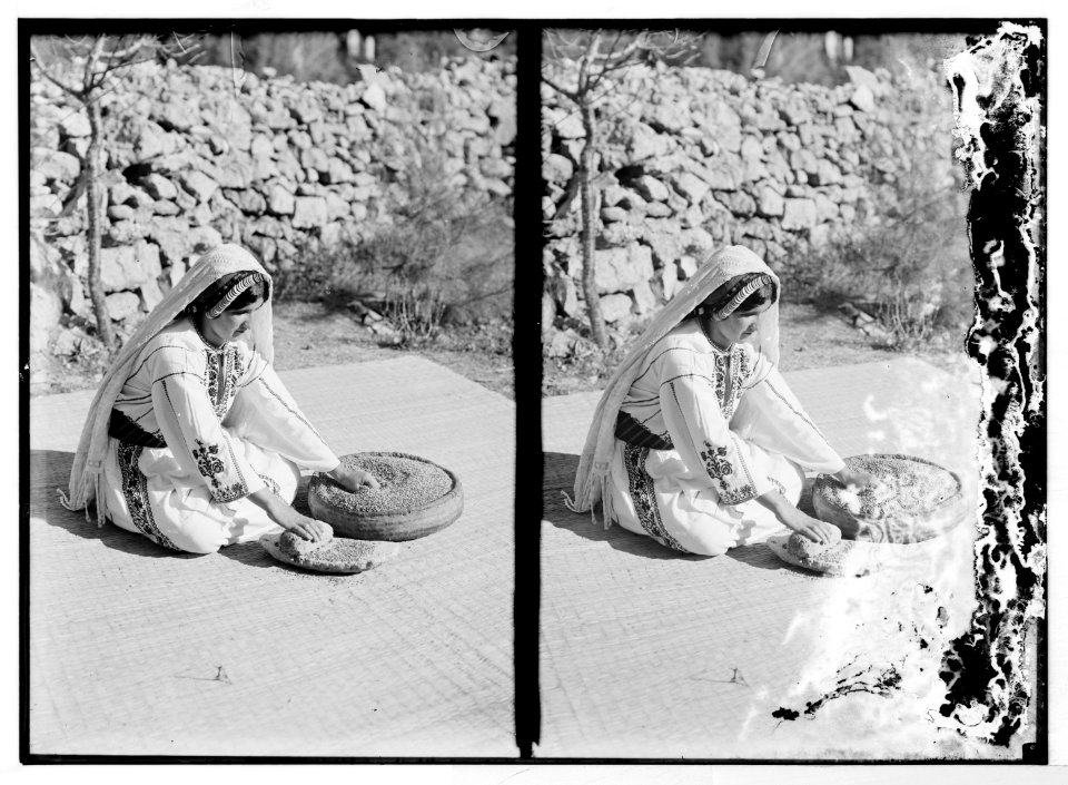 Arab women working primitive grain mill LOC matpc.06016