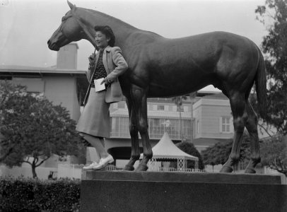 Arcadia, California. Mrs. Lily Okuru poses with statue of Seabiscuit in Santa Anita Park, now an . . . - NARA - 537056 (cropped)