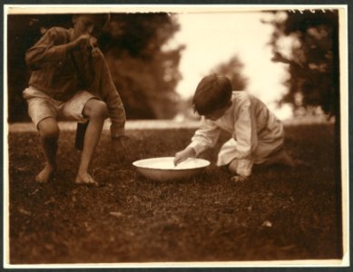 Archie & Quentin making the suds for soap bubbler LCCN2009633583