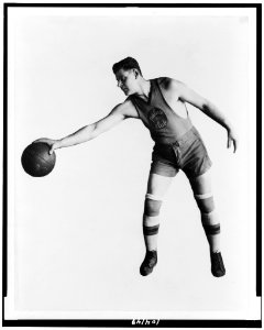 Basketball player of the Palace Club holding basketball upside down with one hand, Washington, D.C., area LCCN91787384