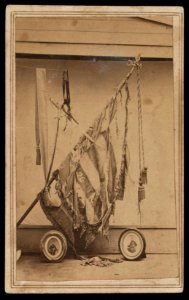 Battle-torn regimental flag of 76th Ohio Infantry Regiment with photographs of Major General Charles Robert Woods and Major Genral William Burnham Woods) - Z.P. McMillen, photographer LCCN2016649602