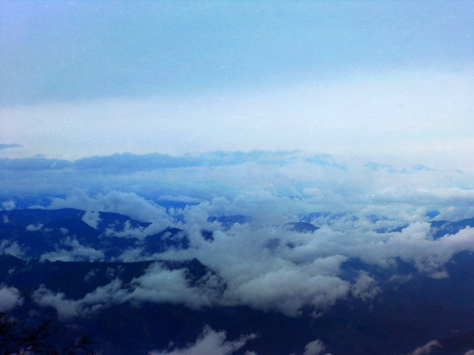 Mountains peaks above the clouds photo