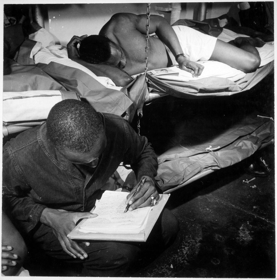... sailors in their bunkroom aboard the U.S.S. Ticonderoga (CV-14) on eve of the Battle of Manila, PI. Thomas L. Crens - NARA - 520867