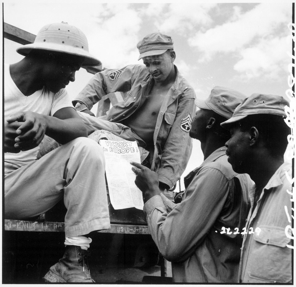 ... troops in Burma stop work briefly to read President Truman's Proclamation of Victory in Europe. - NARA - 531341