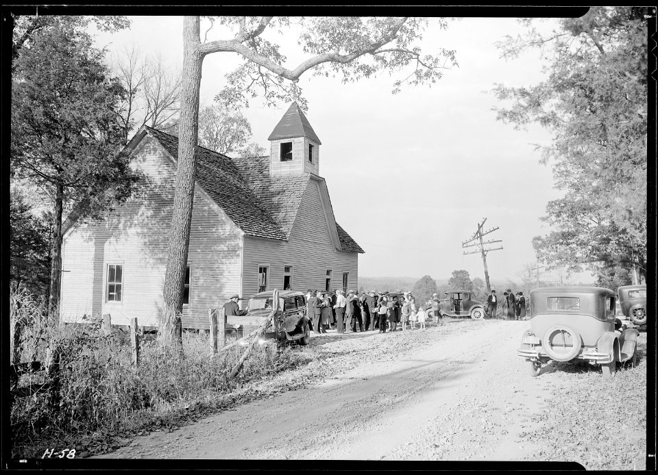 A little country church, Sharps Station M.E. Church, near Loyston, Tennessee. Congregation leaving at close of the... - NARA - 532681