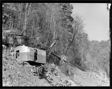 Another view of power shovel making roadway on hillside at Norris Dam site. - NARA - 532703 photo