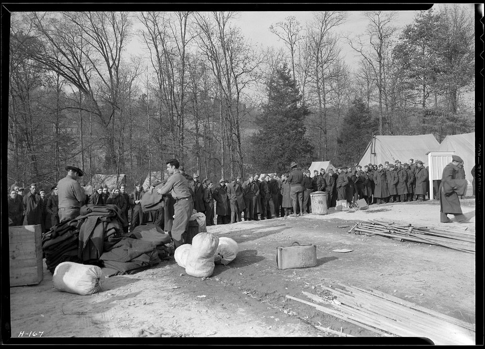 Another view of the issuing of equipment to the new arrivals at CCC Camp, TVA ^23, between Walker's Ford and Lone... - NARA - 532785