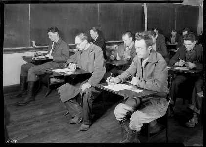 Applicants for skilled and unskilled laboring positions with the TVA being examined at High School building... - NARA - 532811 photo