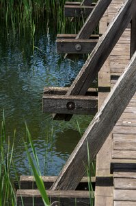 Wooden construction river reflection photo