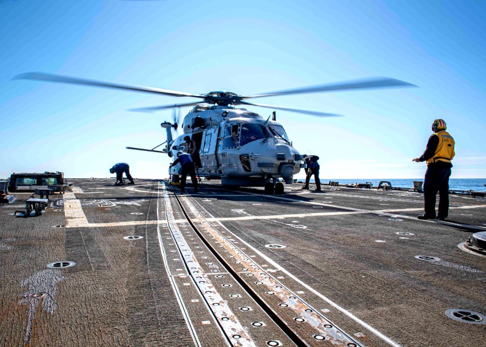 190909-N-UB406-0088 Sailors aboard the guided-missile destroyer USS Gridley (DDG 101) conduct flight operations with an NH90 helicopter from the Royal Netherlands navy frigate HNLMS Van Speijk (F 828)