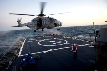 191129-N-CJ510-0276 A French navy NH90 helicopter lands on the flight deck of the Arleigh Burke-class guided-missile destroyer USS Ross (DDG 71)