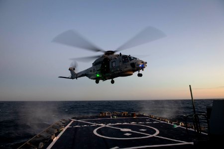 191129-N-CJ510-0376 French navy NH90 helicopter departs the flight deck of the Arleigh Burke-class guided-missile destroyer USS Ross (DDG 71)