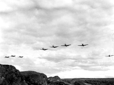 192nd Fighter-Bomber Squadron, North American F-51D Mustangs, low level formation flight over volcanic terrain in Iceland