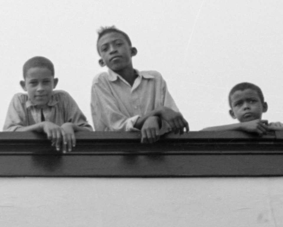 1938 detail, Crowley Negro Boys On Billboard Russell Lee (cropped)