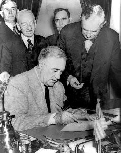 Franklin Roosevelt signing declaration of war against Germany photo