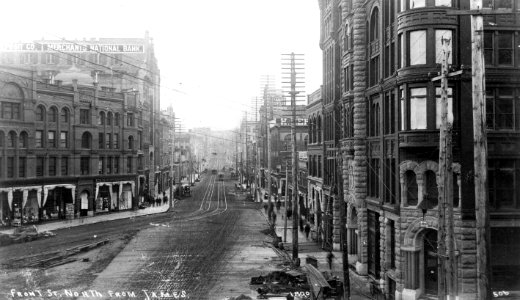 1st Ave looking north from James St and the Pioneer Building, Pioneer Square district, Seattle, 1890 (WARNER 609) photo