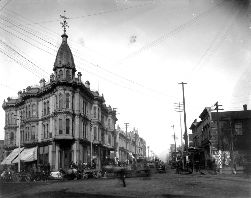1st Ave looking northwest from Yesler Way toward the Yesler-Leary Building, Seattle, 1888 (WARNER 619)