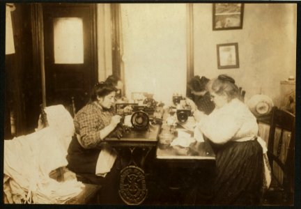 2 P.M. Workers on gloves, crowded into a small kitchen (photograph very inadequately represents congestion). Dallavalla, 50 McDougal St. LOC nclc.04126