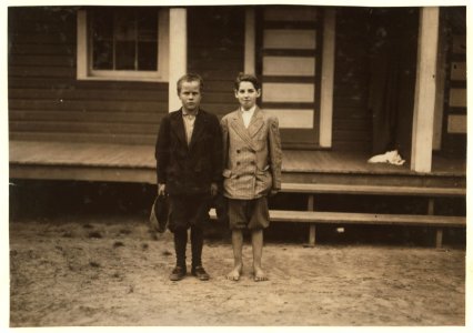 2 violations. Simon Birdsong (left hand boy) said- 'I'm about 12.' His mother said- 'He's old enough to work all right,' but the boy admitted that she had to sign up that he was older than LOC nclc.02974
