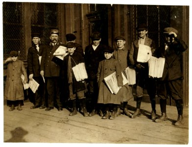 2-15 P.M. Some of the 'crew' at ferry, Jersey City, N.J. On extreme left, Sam, 10 yrs. old - 'I've got to support the family,' he said. Small boy on right centre his broth(er), William 12 LOC nclc.03812